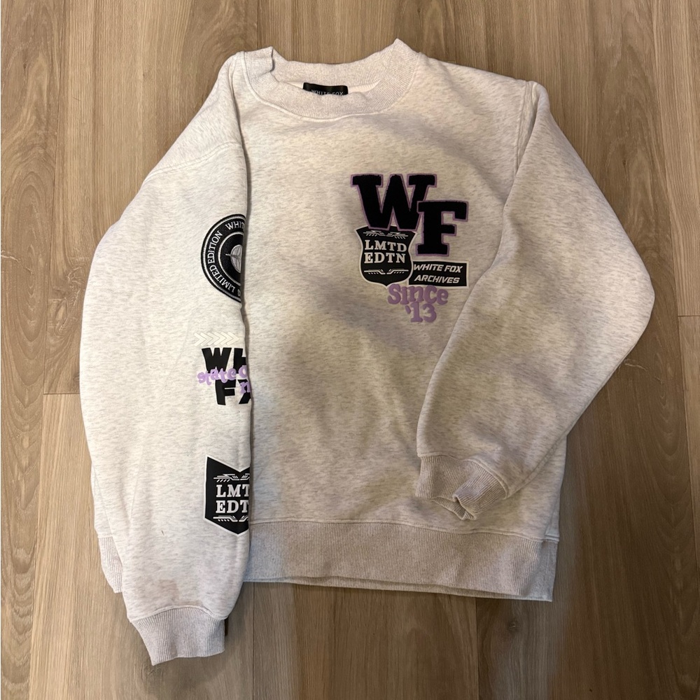 White Fox Sweatshirt with Black and Purple Patches